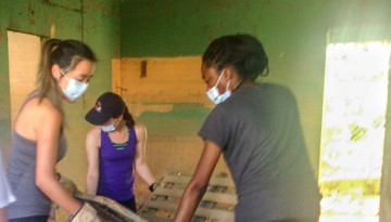 Elle Espinoza, Courtney Cheng, Alexis Pollitto and Ajara Cobourne clean out a Puerto Rican home ravaged by Hurricane Maria