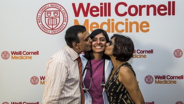 Nivita Sharma celebrates receiving her white coat alongside her parents