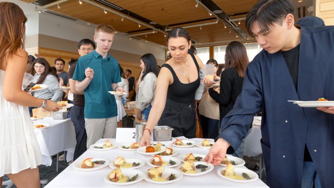 Students sample their professors’ dishes at their Faculty Cooking Throw Down.