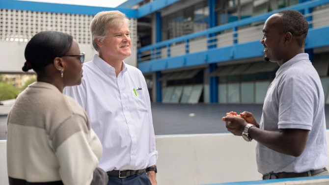 At center, Dr. Daniel Fitzgerald, director of Weill Cornell Medicine’s Center for Global Health, chats with Dr. Grace Ruselu, left, and Dr. Godfrey Kisigo, right, at Bugando Medical Centre in Mwanza, Tanzania.