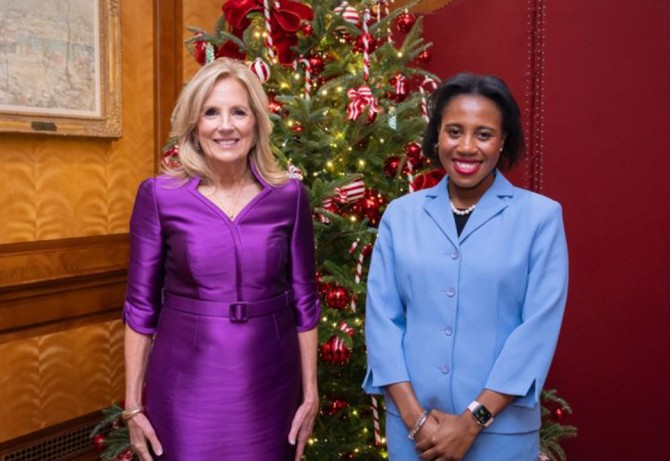 Shelby Lynn Williams '25 standing with Dr. Jill Biden in front of a holiday tree at the White House