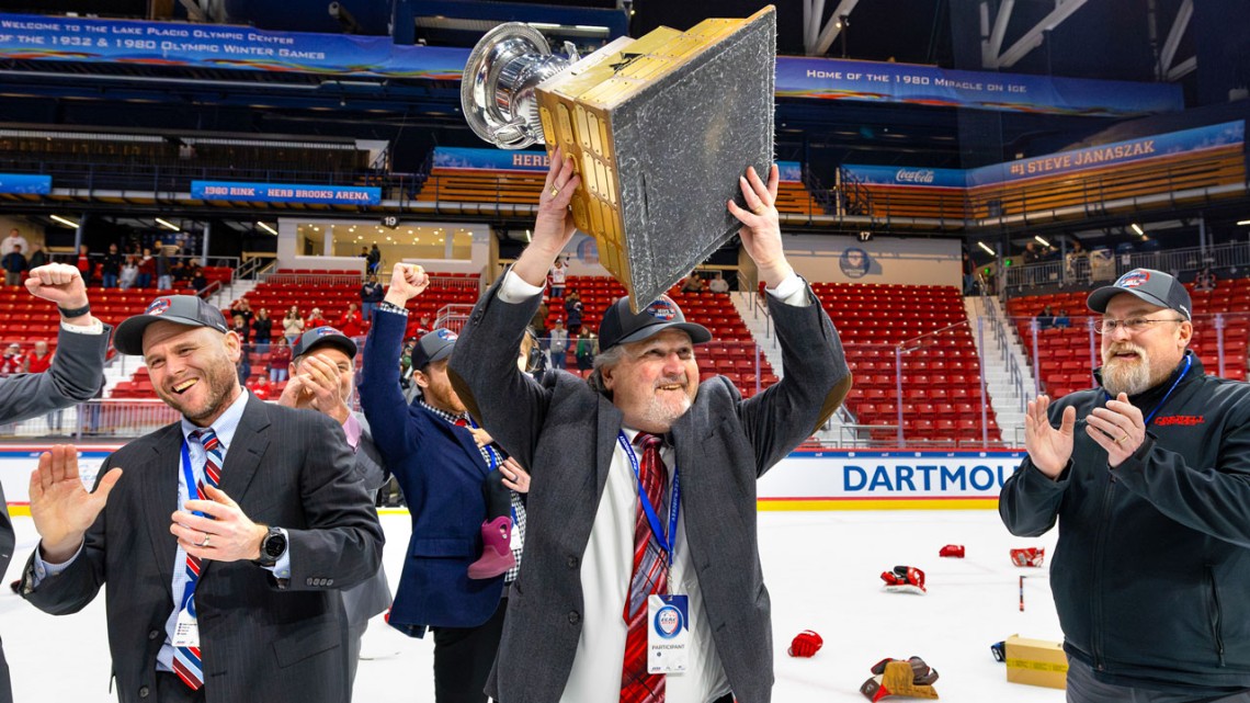 Mike Schafer, the Jay R. Bloom ’77 Head Coach of Men’s Hockey, lifts up the Whitelaw Cup after leading the Big Red past St. Lawrence to claim the 2024 ECAC Hockey Tournament title on March 23 in Lake Placid, N.Y.