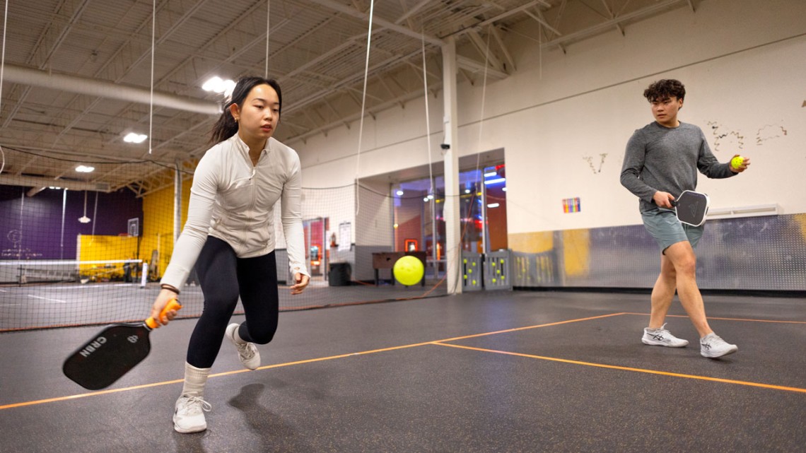 Rachel Zhang ’27 and Jason Cho ’27 practice pickleball at Pickleball Mania at the Shops at Ithaca Mall.