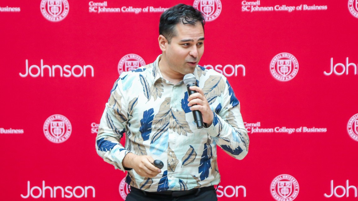 MBA student John Khazraee pitches his startup Investwise Learning to an audience at Johnson Summer Startup Accelerator Demo Day.