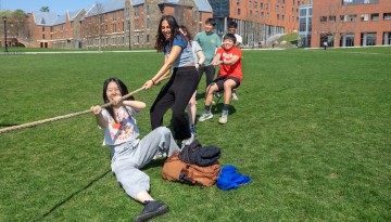 Students gather for a light-hearted game of tug-of-war on Rawlings Green.